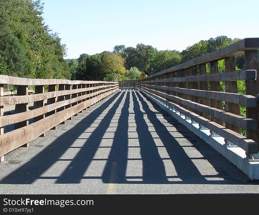 A bridge lined with shadows shot in Green Lane Park, Pennsylvania. A bridge lined with shadows shot in Green Lane Park, Pennsylvania.