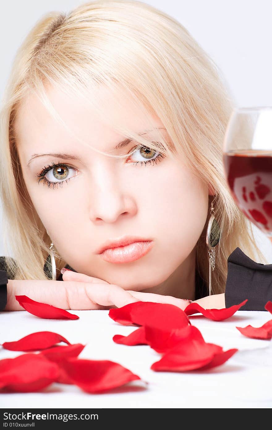 Cute blonde with wine and petals. Cute blonde with wine and petals