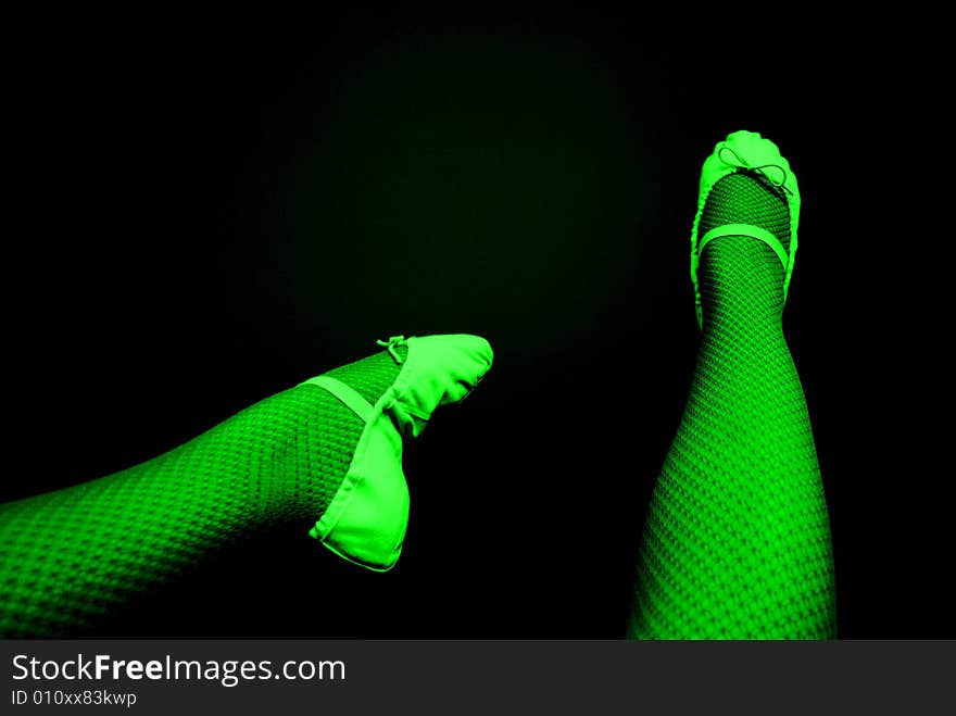 Photograph featuring a dancer's legs & feet, with fishnet tights and ballet shoes. Photograph featuring a dancer's legs & feet, with fishnet tights and ballet shoes.