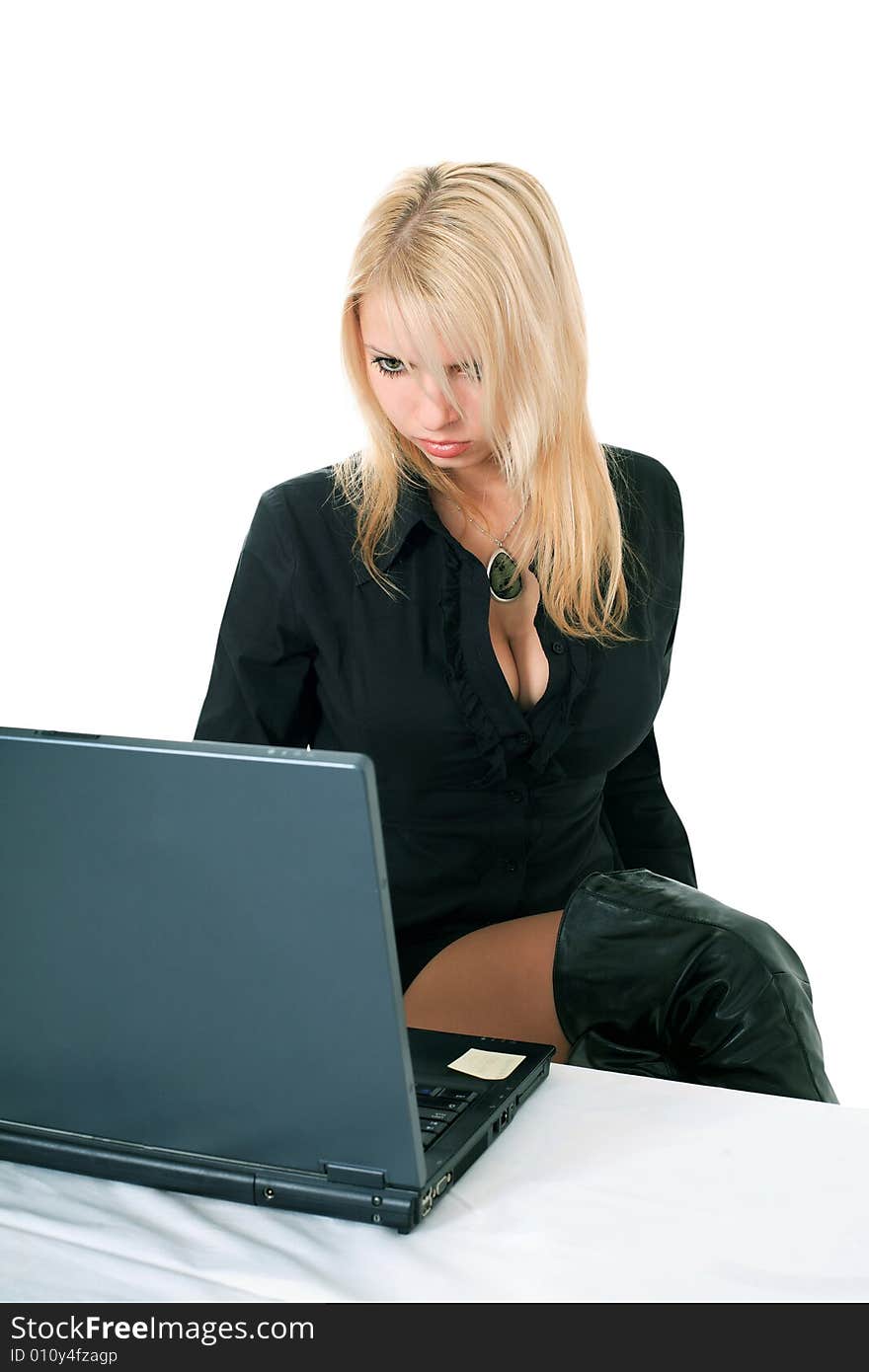 Cute lady in black with a laptop over white. Cute lady in black with a laptop over white