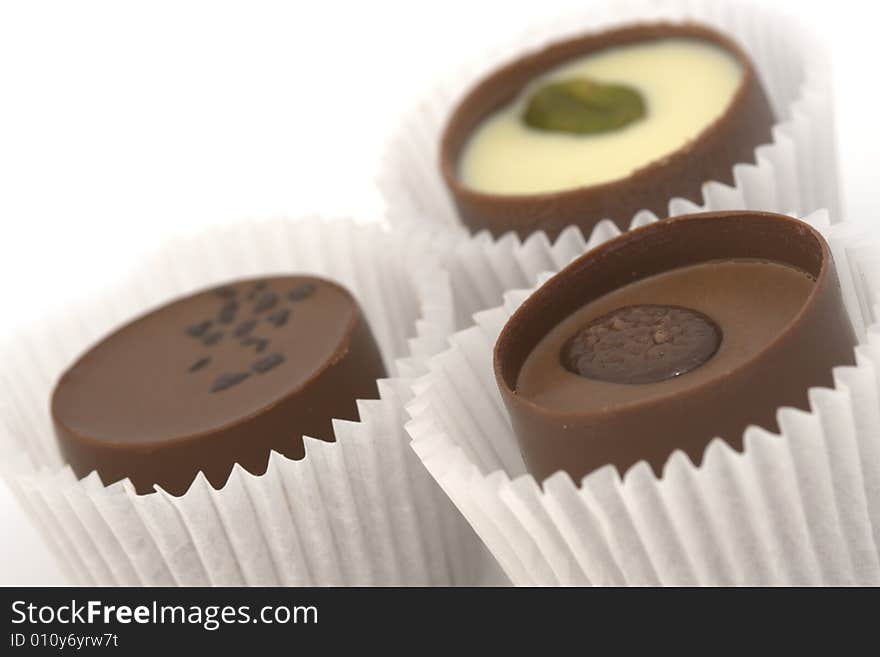 Close-up view of three chocolate desserts