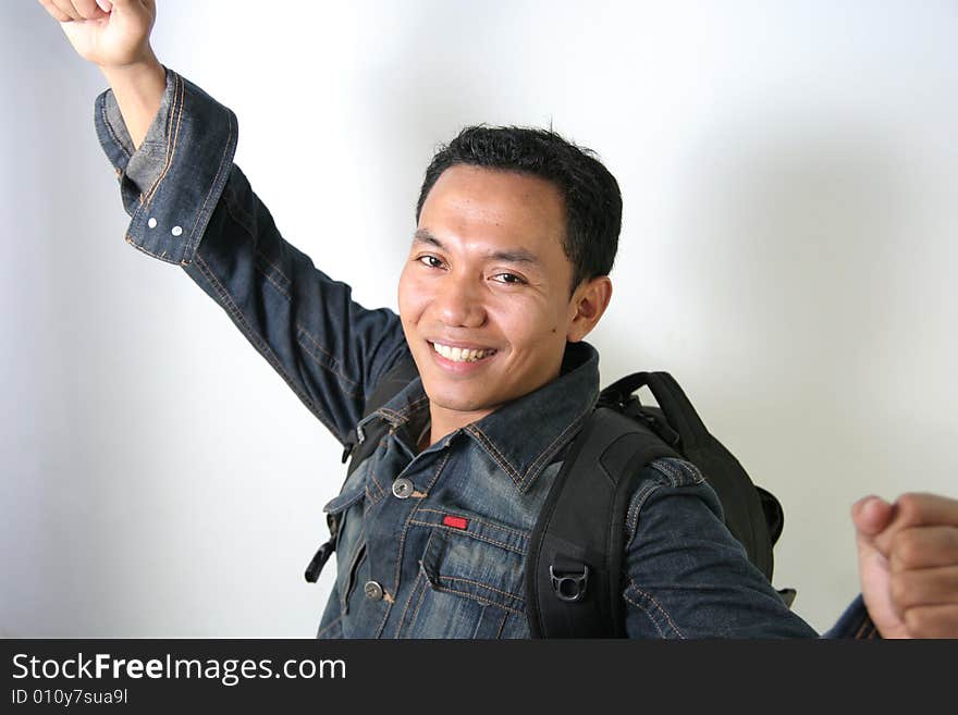 Casual man with jacket and backpack ready to travel