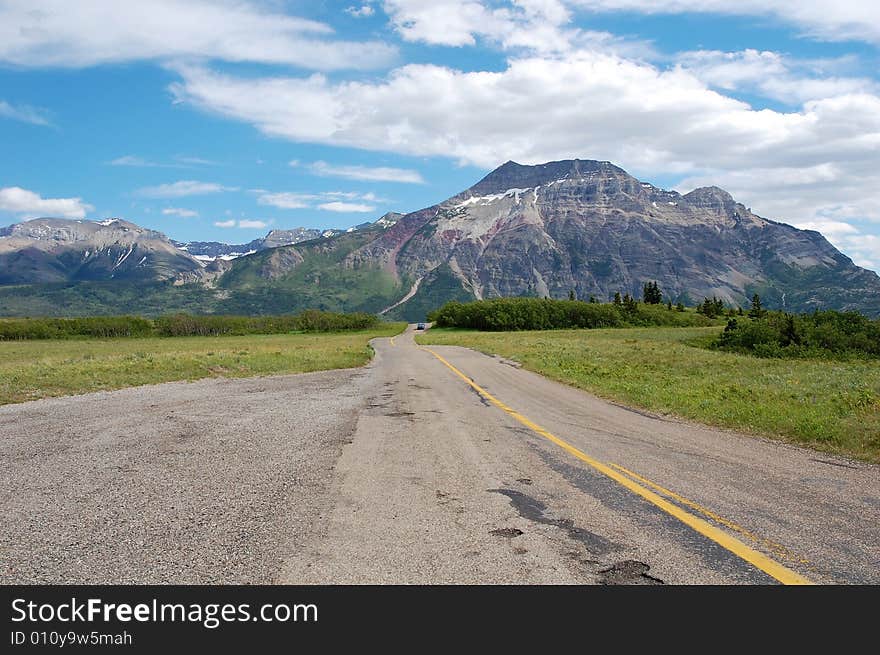 The 8-km scenic drive to the entrance of waterton lake national park, alberta, canada. The 8-km scenic drive to the entrance of waterton lake national park, alberta, canada