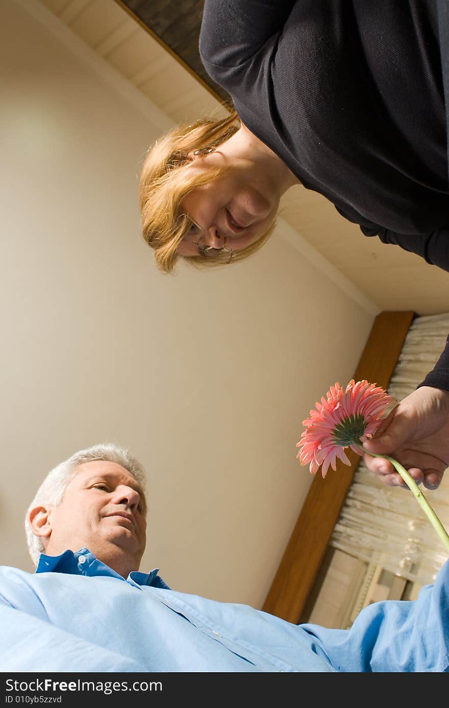 Man Giving Woman Flower - Vertical