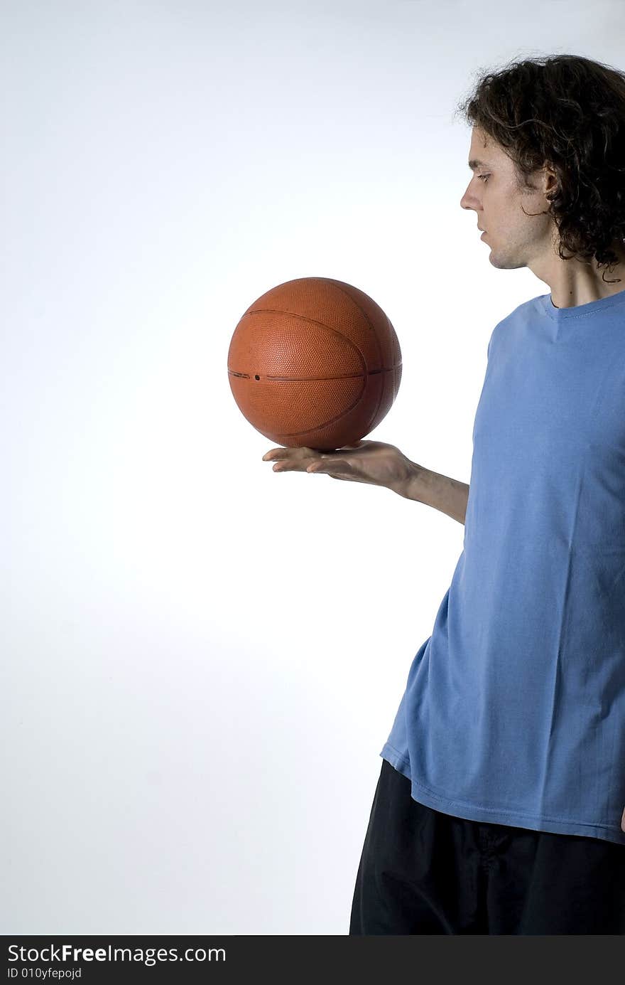 Man Balancing Basketball - Vertical