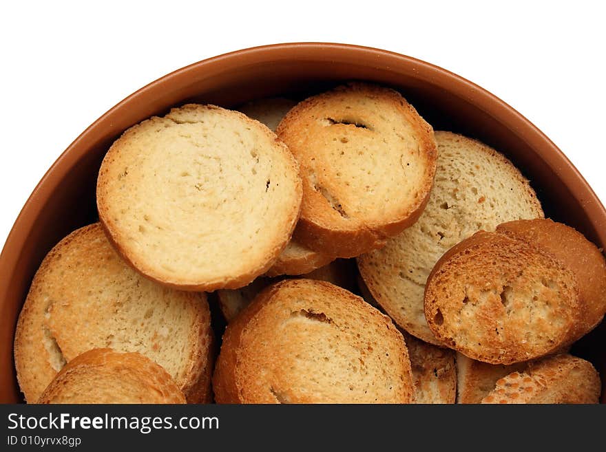 Crackers in brown bowl isolated on white