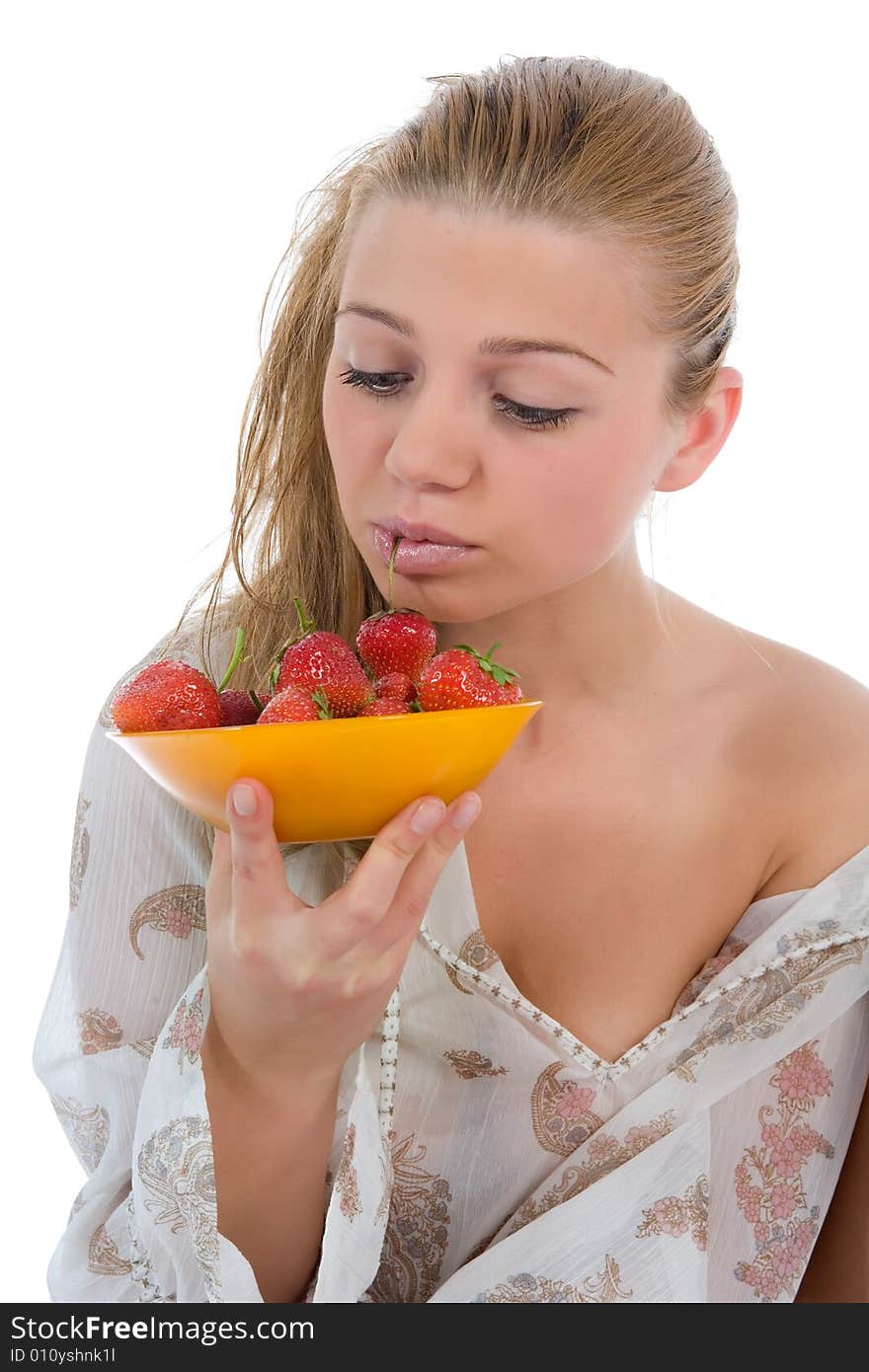 Beautiful girl with strawberry over white