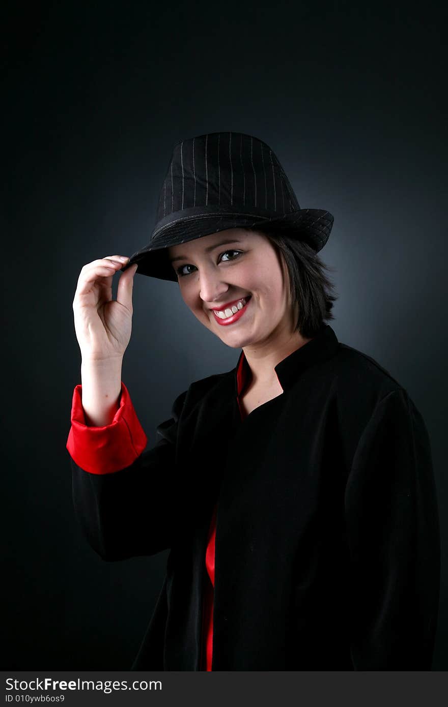 Happy teen in top hat and black and red