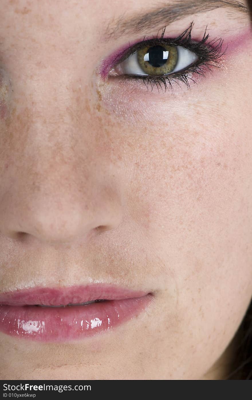 A close up portrait of half a girls face. A close up portrait of half a girls face.