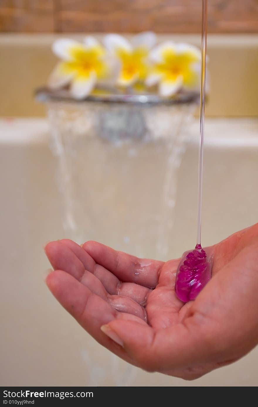 Soap spilling into a hand. Soap spilling into a hand