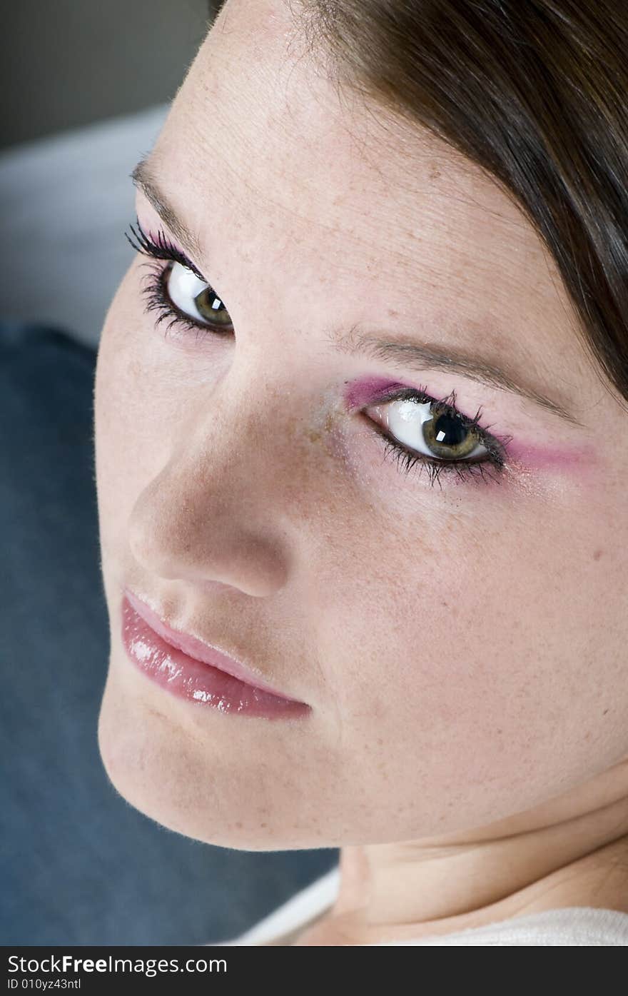 A portrait of half a young woman's face looking back and up. A portrait of half a young woman's face looking back and up.