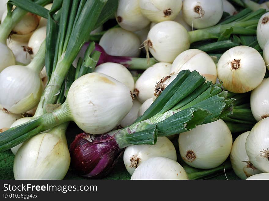 Pile of various onions at the market. Pile of various onions at the market.