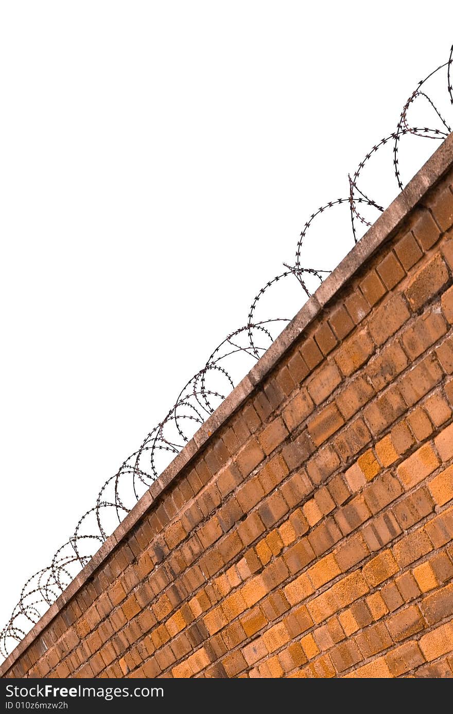 Barbed wire on a brik wall