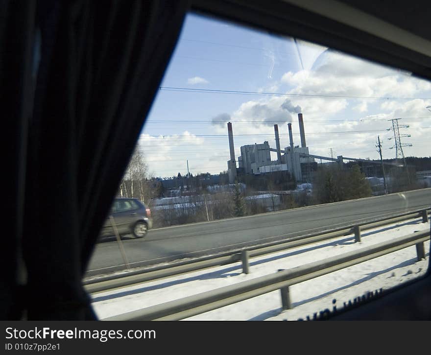 Chimney of a factory out of the window. Chimney of a factory out of the window.