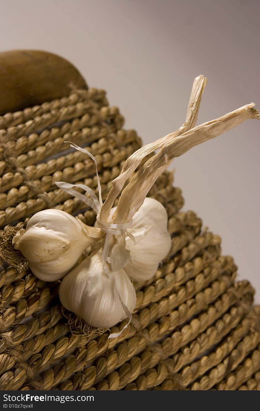 Garlic isloated on white/wood