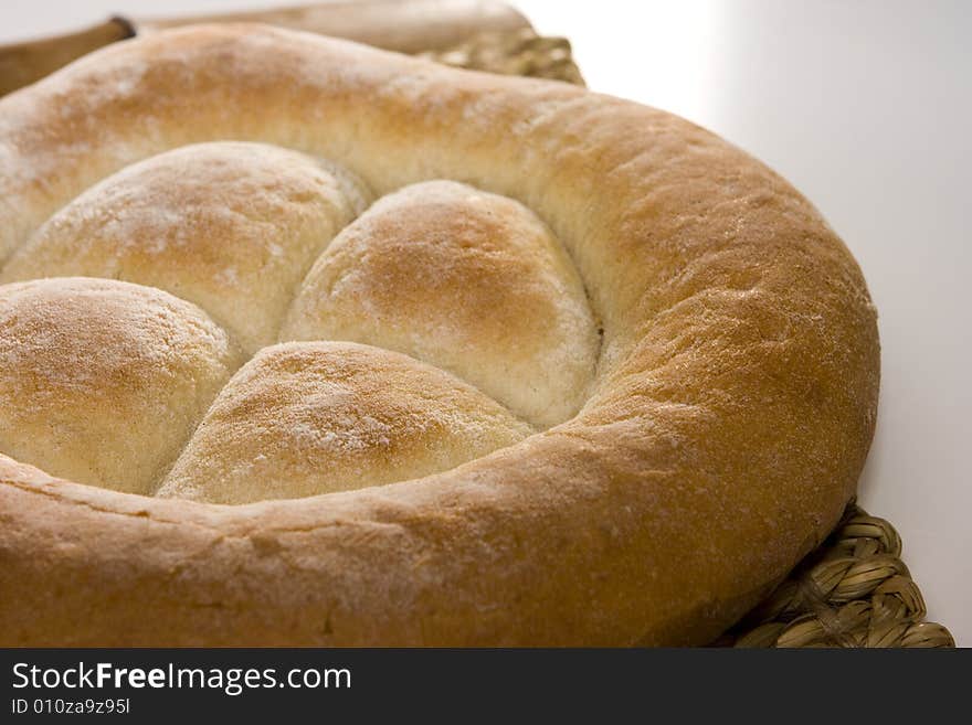 Made in the studio, bread isolated on wood and white; healthy food. Made in the studio, bread isolated on wood and white; healthy food