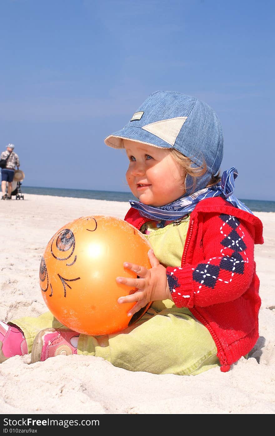 Baby girl and orange ball. Baby girl and orange ball