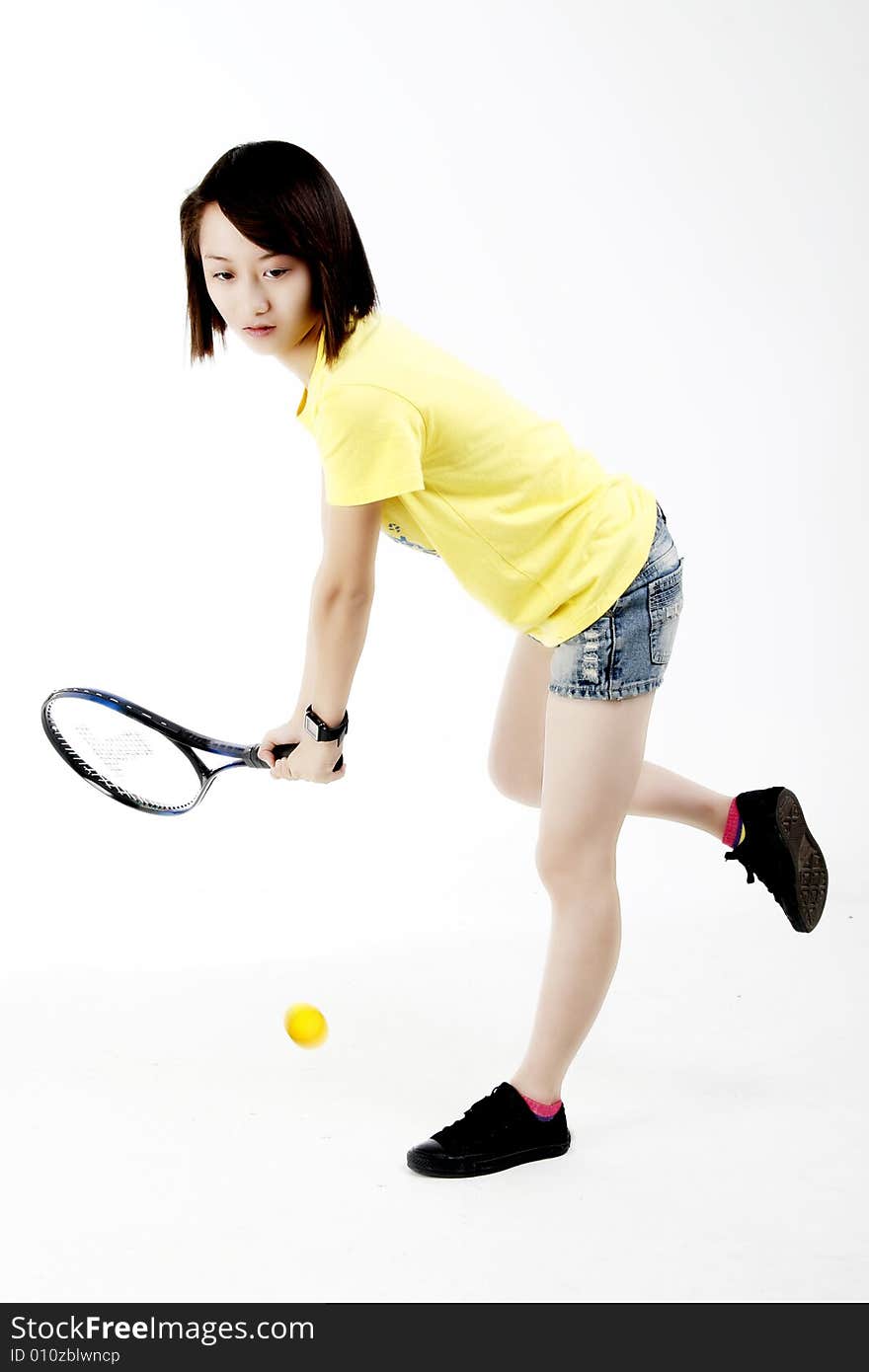 A Chinese girl playing tennis. A Chinese girl playing tennis.