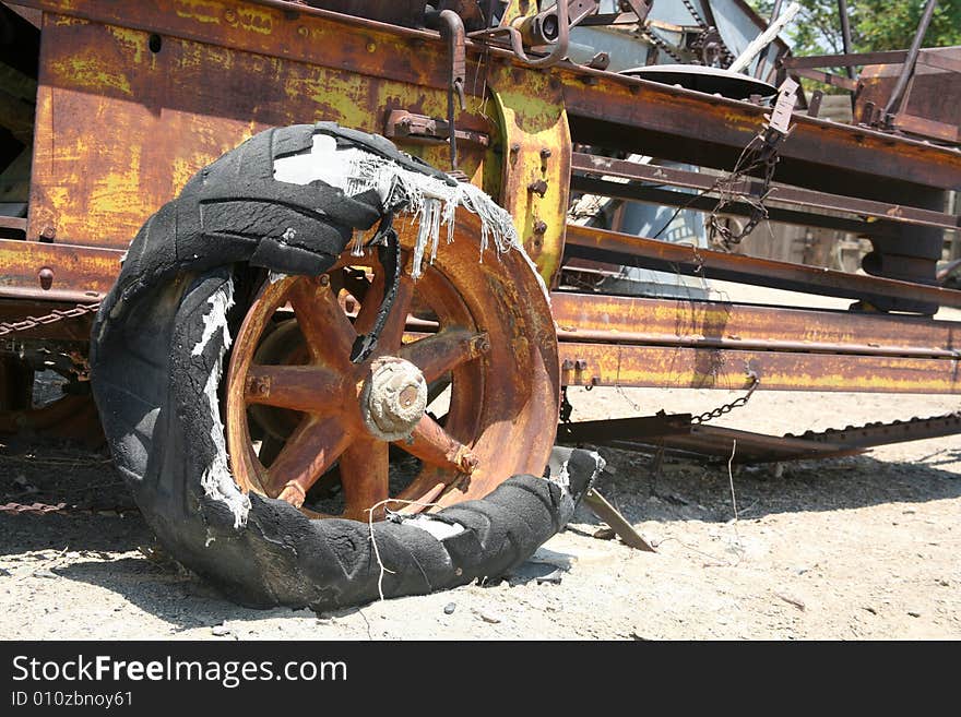 Old-fashioned broken and rust industrial farming equipment