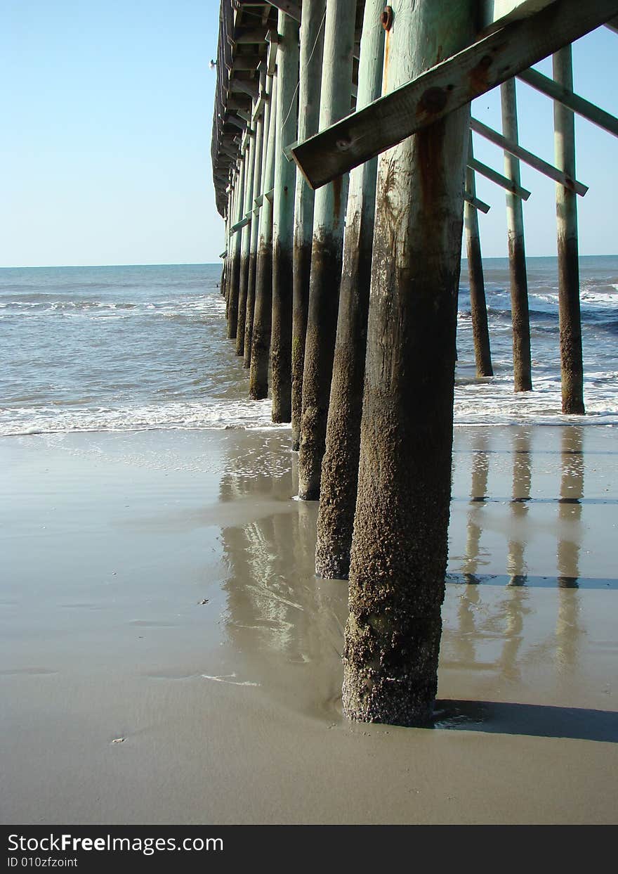 Underneath pier looking out to the ocean. Underneath pier looking out to the ocean