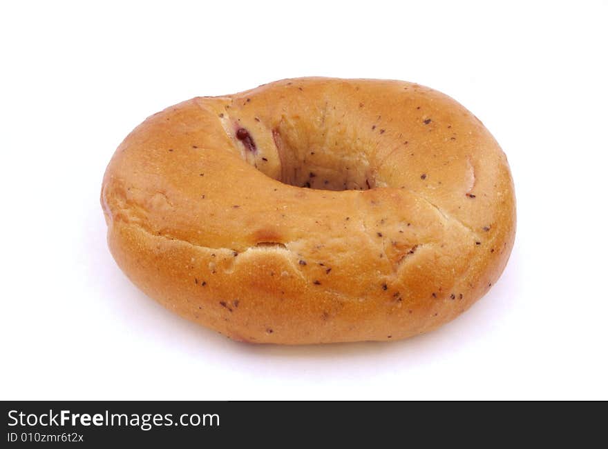 A photograph of a blueberry bagel against a white background