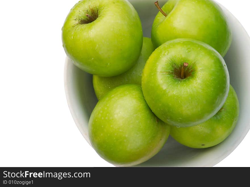 Close-up Of Granny Smith Apple In White Bowl