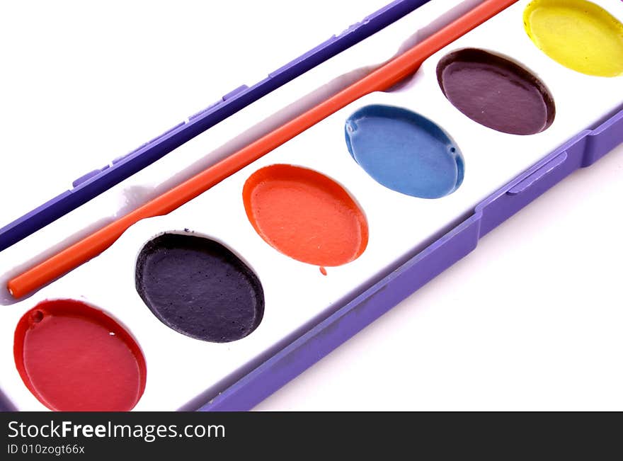 A photograph of a paint set against a white background. A photograph of a paint set against a white background