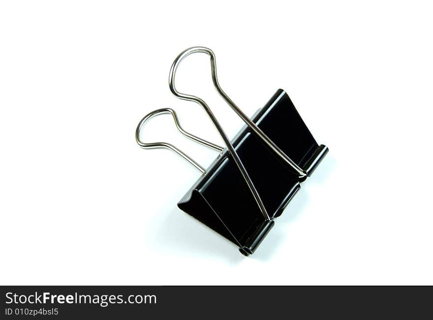 A photograph of a paper clamp against a white background