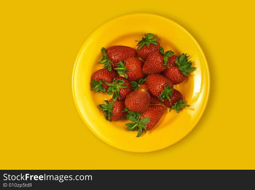 Sweet strawberries on yellow plate. Sweet strawberries on yellow plate