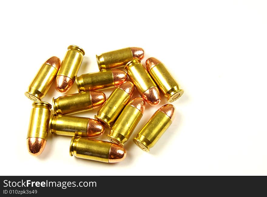 A photograph of dropped bullets against a white background