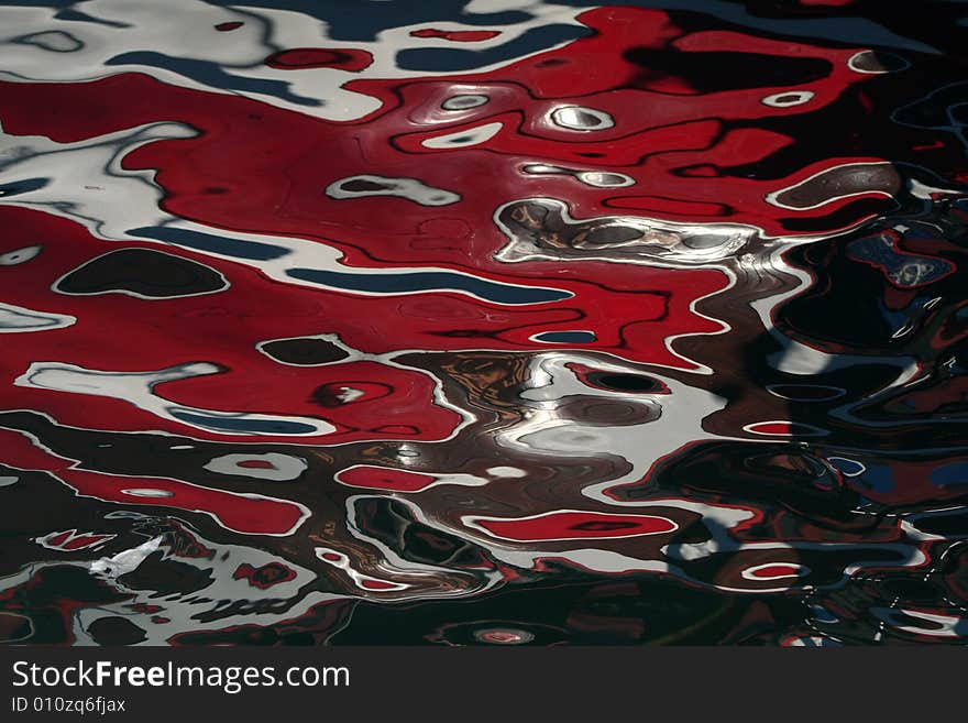 Seawater with reflections of a boat