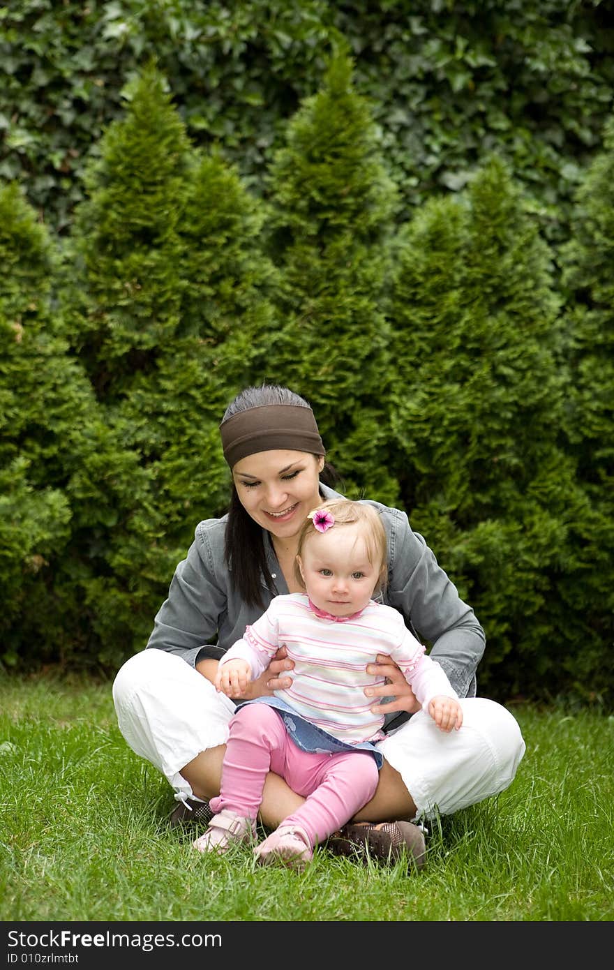 Happy family on green meadow. Happy family on green meadow