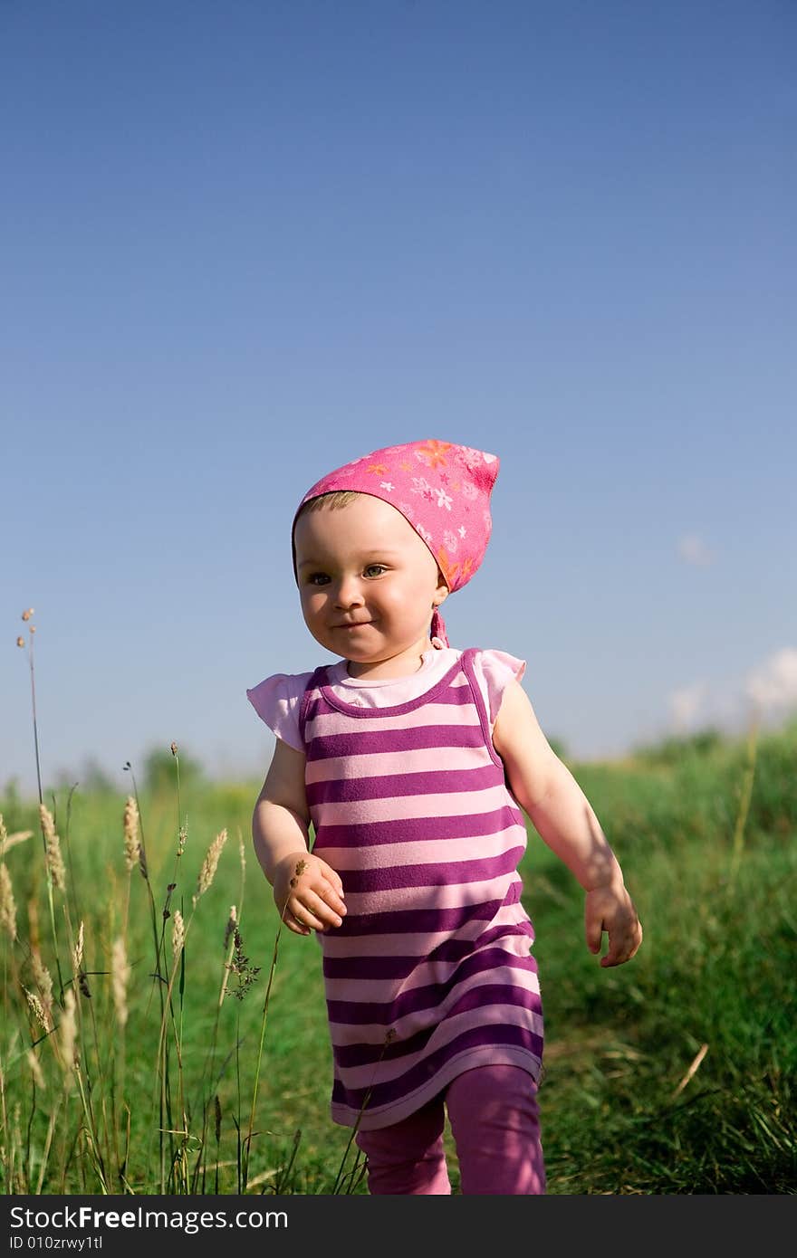 Happy baby girl on green meadow. Happy baby girl on green meadow