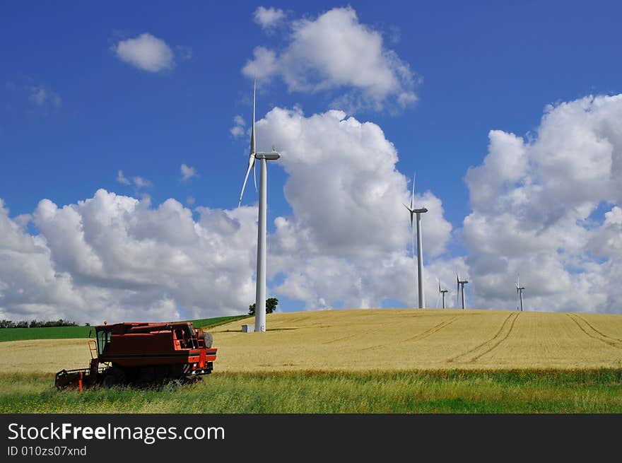 Harvester in field, summer in France