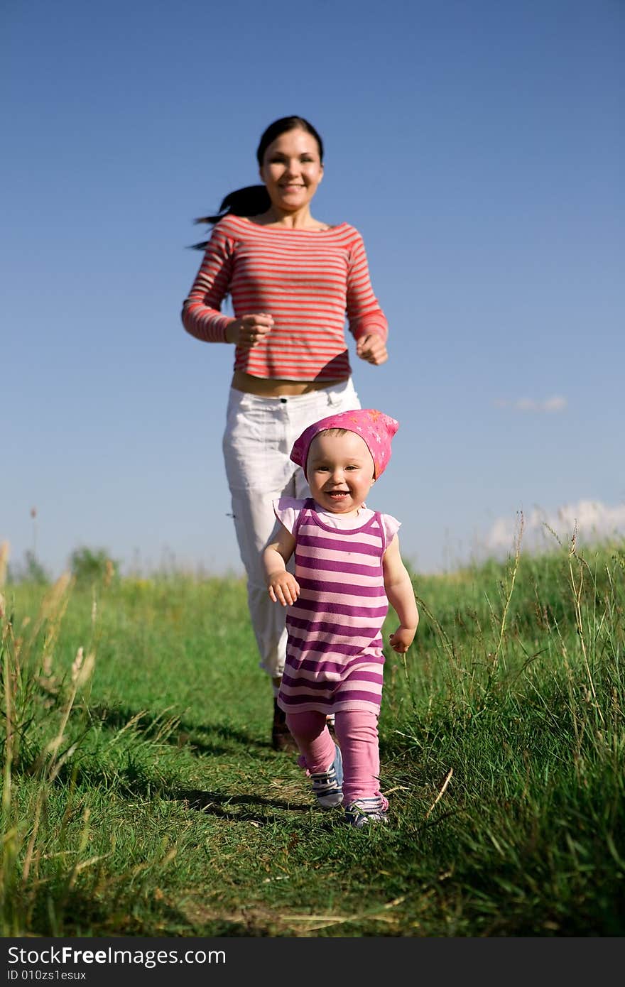 Happy family on green meadow. Happy family on green meadow