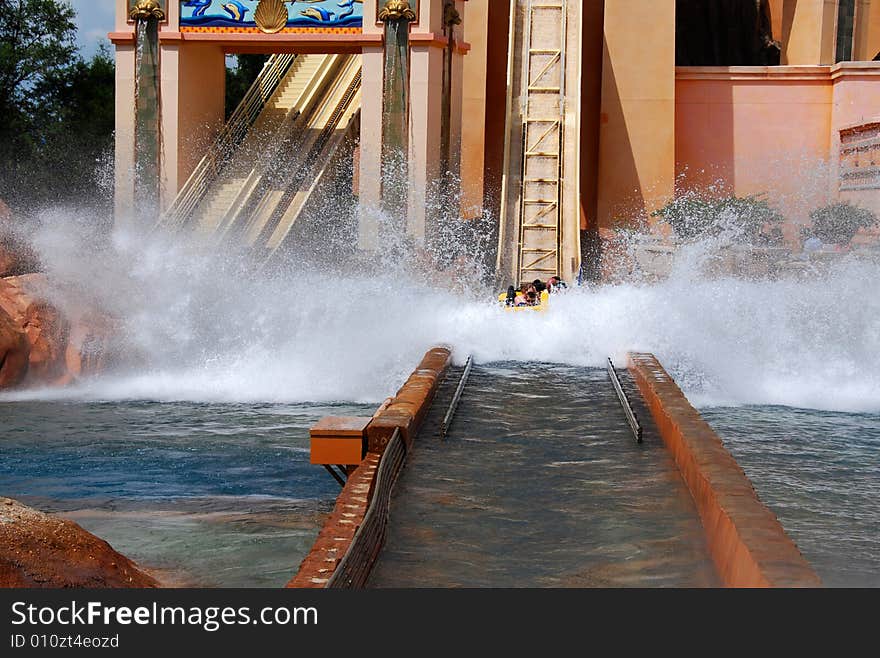 People fall into water during a ride in a water park. People fall into water during a ride in a water park