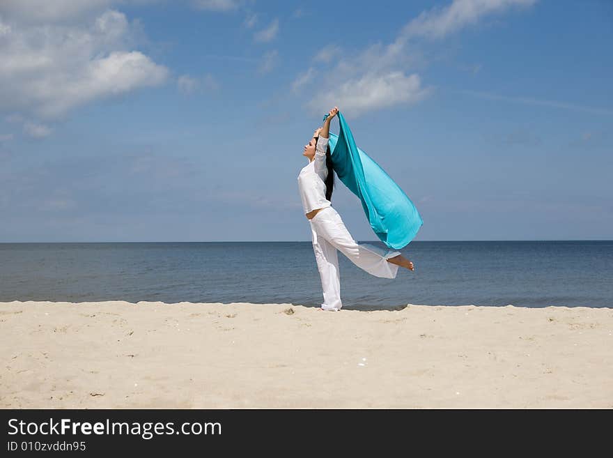 Attractive brunette woman relaxing on beach. Attractive brunette woman relaxing on beach