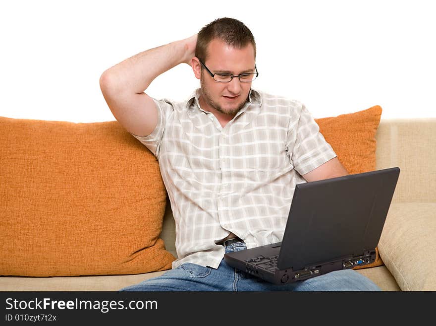 Happy man sitting on sofa with laptop. Happy man sitting on sofa with laptop