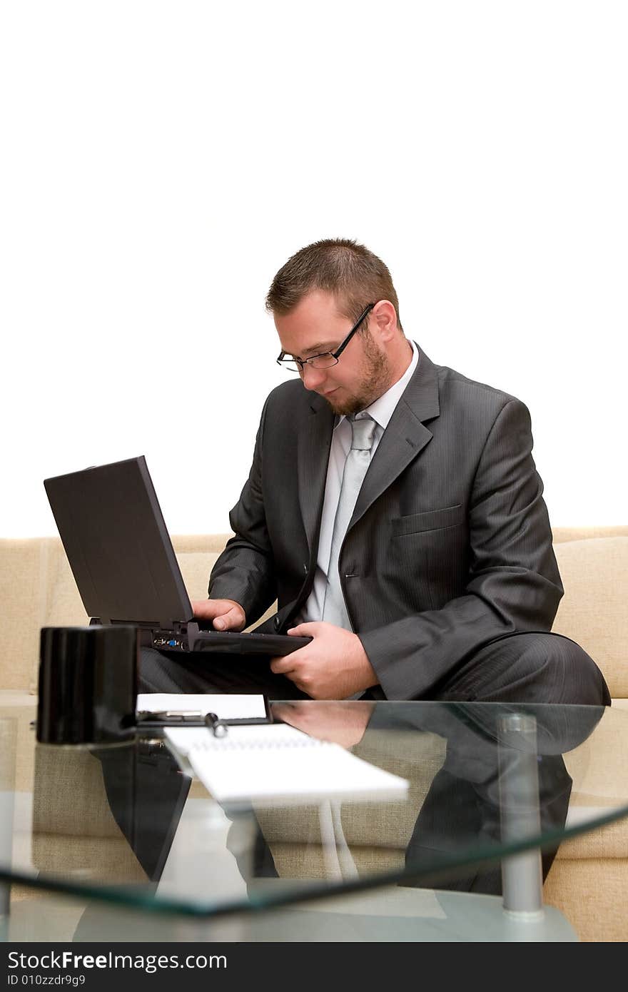 Happy man sitting on sofa with laptop. Happy man sitting on sofa with laptop