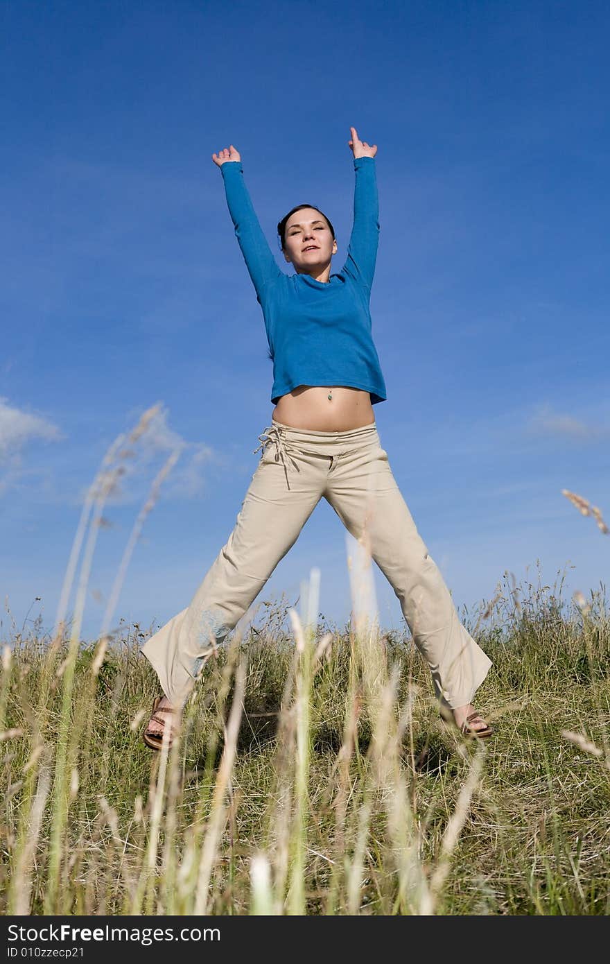 Attractive brunette woman relaxing on meadow. Attractive brunette woman relaxing on meadow