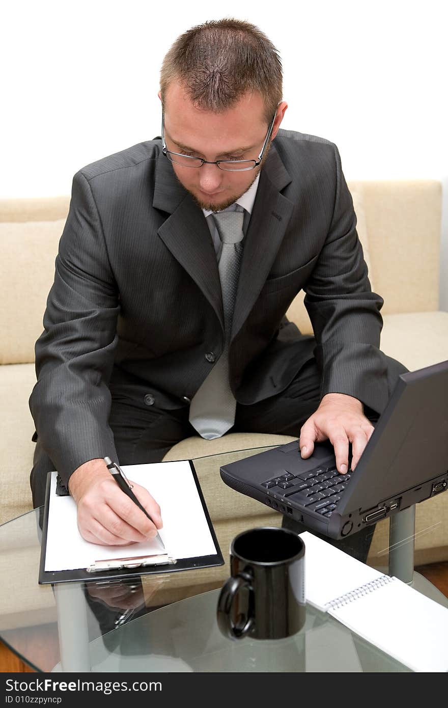 Happy man sitting on sofa with laptop. Happy man sitting on sofa with laptop