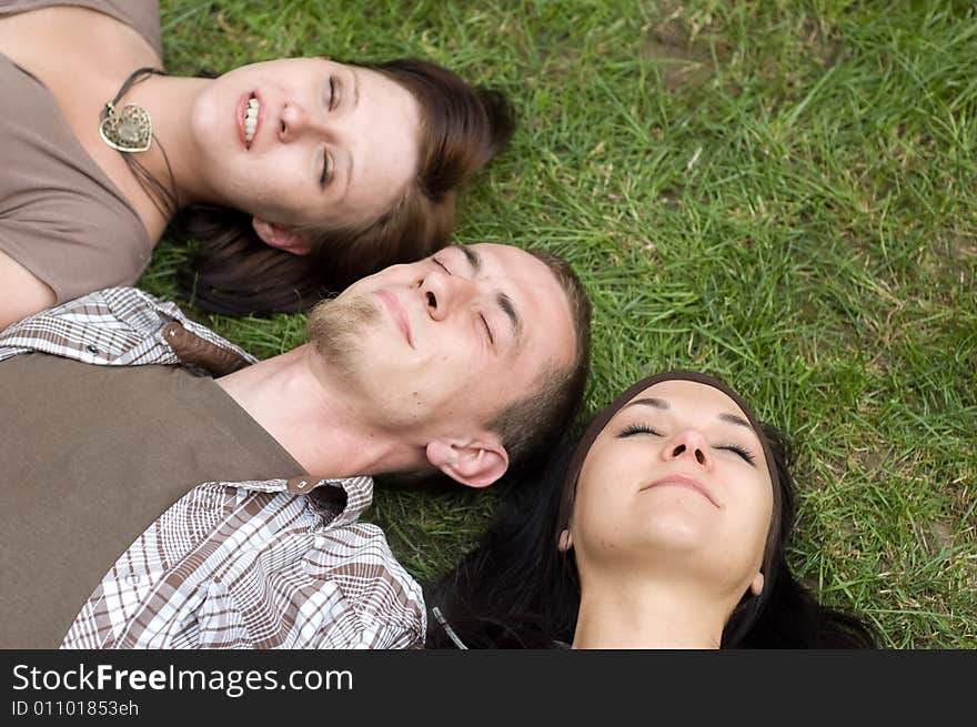 Friends together relaxing on grass. Friends together relaxing on grass