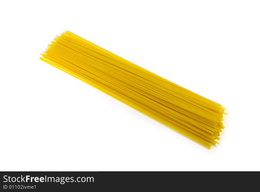 A photograph of dried spaghetti against a white background