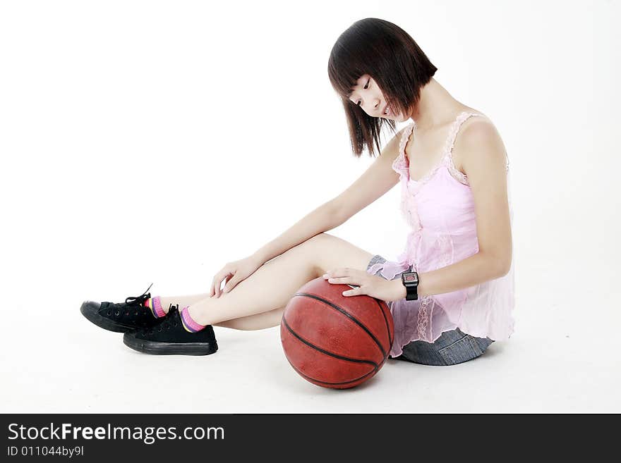 A Chinese girl and basketball. A Chinese girl and basketball.