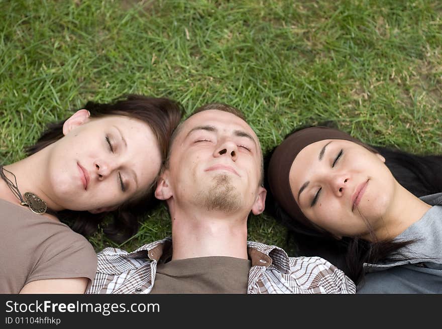 Friends together relaxing on grass. Friends together relaxing on grass