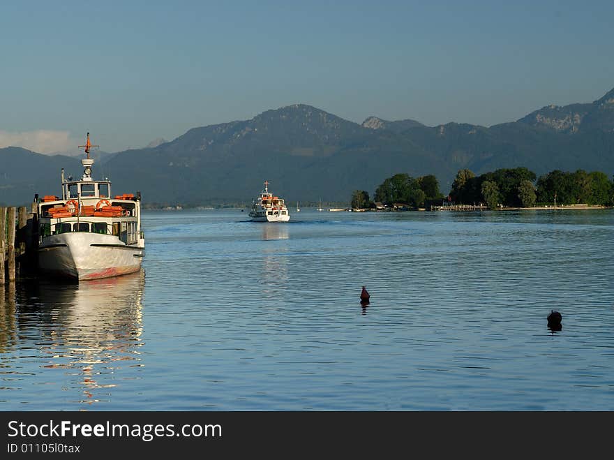 Two ships on the Bavarian Alps lake in sunset