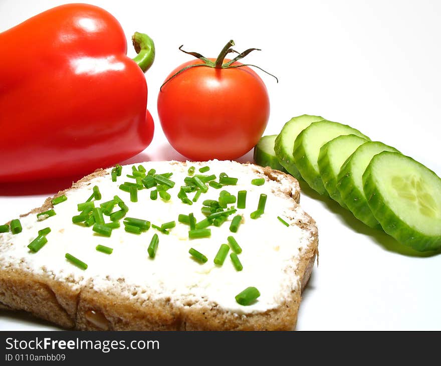 Detail bread with butter and fresh vegetable. Detail bread with butter and fresh vegetable