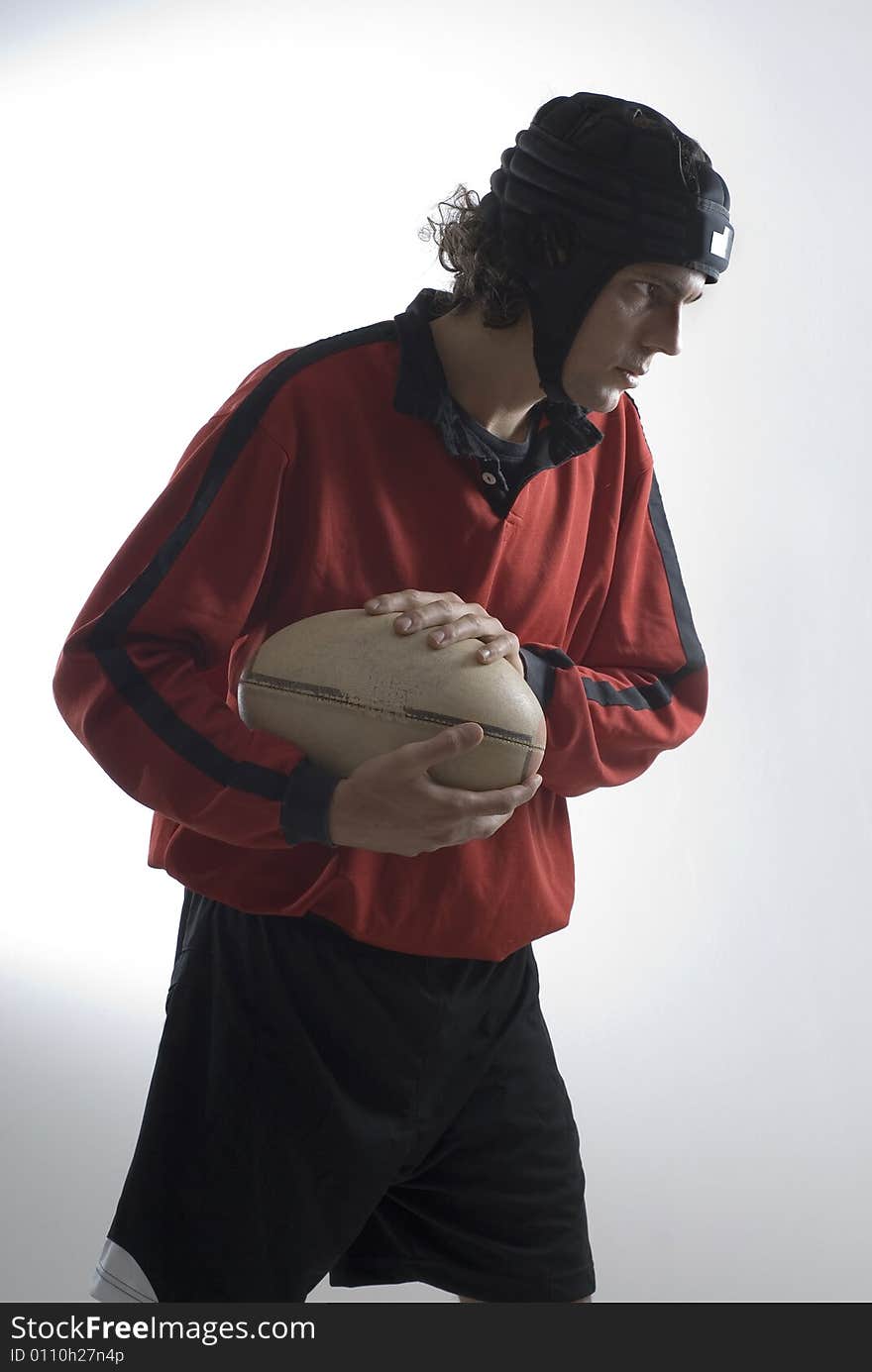 Man Holding a Football - Vertical