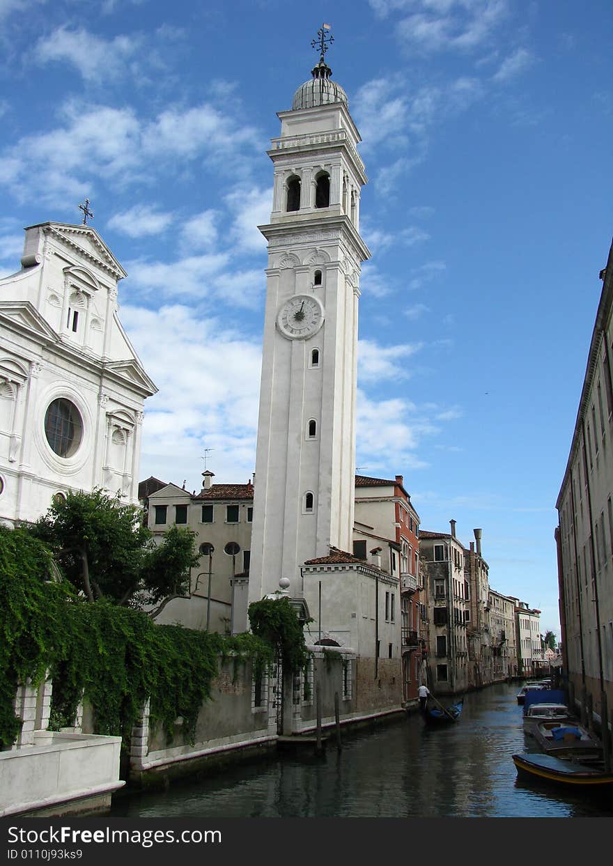 A church in Venice, Italy, leans slightly next to a canal. A church in Venice, Italy, leans slightly next to a canal