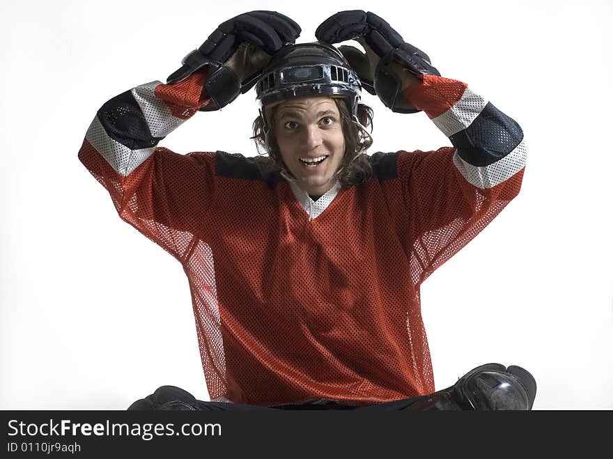 Hockey player jokes around with his hands on top of his head. Horizontally framed photograph. Hockey player jokes around with his hands on top of his head. Horizontally framed photograph